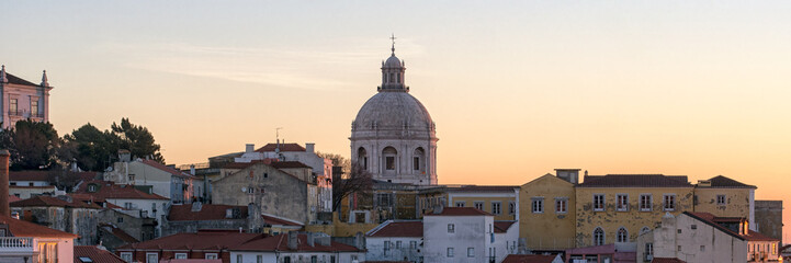 Fototapeta premium View over the Alfama District of Lisbon at Dawn from the Miradouro das Portas Do Sol in Lisbon