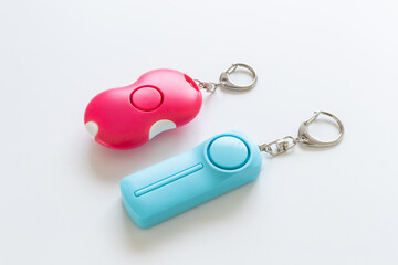 白背景に防犯ブザーや防犯アラームの写真素材　防犯グッズ　防犯対策