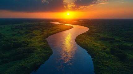 Majestic Sunset Over a Serpentine River in Lush Green Landscape