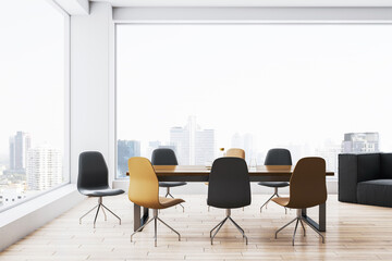 Modern dining room with wooden table and colorful chairs in bright interior with large windows and city view in background. 3D Rendering