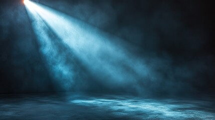 A dramatic spotlight illuminates a specific area against a dark gray background
