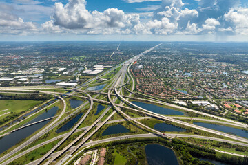 American highway junction with fast driving vehicles in Miami, Florida. USA urban transportation...