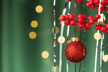 Green Background with Ilex, Christmas Balls, and Tinsel