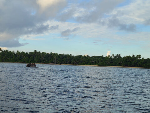 Shipwreck in front of a tropical island