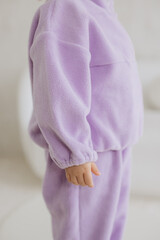 Purple fleece mockup featuring child wearing cozy sweatsuit