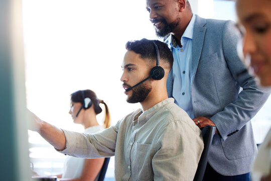 Call center, help and man in training with mentor for learning telemarketing and customer service. Advisor, coaching and people on computer for consulting advice, support or question in business