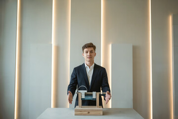 Fototapeta premium Confident young entrepreneur presenting innovative project in modern office spacea vision for future business success