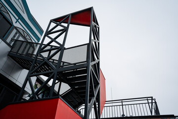 A fire escape is an essential safety feature that is constructed into a building, providing...