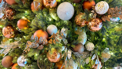 Obraz premium Indoor Christmas tree closeup with decoration bronze and golden balls