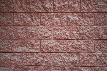Obraz premium Modern Brick Wall with Unique Geometric Pattern - Close-up of a Minimalist Textured Surface Featuring Stylish Brown Tones and Creative Design for Architectural Backgrounds, Urban Themes, and Interior 