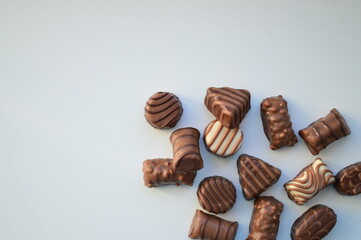 Assortment of Chocolate Pralines on White Background. A luxurious selection of chocolate pralines...