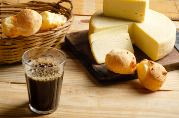 Cheese and cheese bread, a beautiful breakfast table with Brazilian delicacies and accessories on...