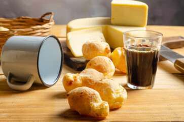 Cheese and cheese bread, a beautiful breakfast table with Brazilian delicacies and accessories on...