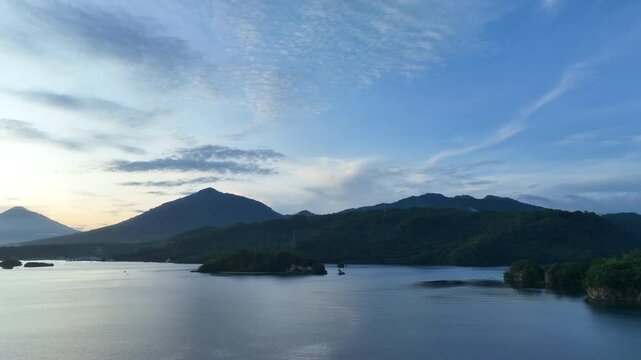Calm water flows through Lembeh Strait, separating North Sulawesi from Lembeh Island. This tropical area is home to a plethora of marine biodiversity and is popular among divers.