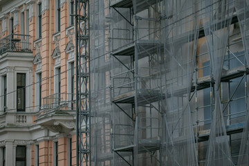 Industrial scaffolding renovation and construction lift chute. facade renovation scaffolding systems
