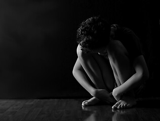 boy in poverty being bullied at school with depression no help crying alone and all by himself on...