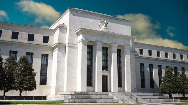 A time lapse captures the Federal Reserve building in Washington, DC, reflecting American finance's evolution, focusing on economy and interest rates.