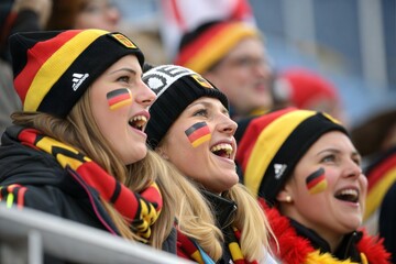 Fototapeta premium German Pride: Fans in Black, Red, and Gold Cheering for Alpine Skiing