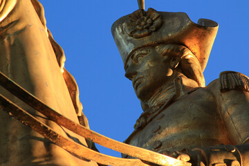 Gold Statue of General on Horseback Against a Blue Sky, Macro