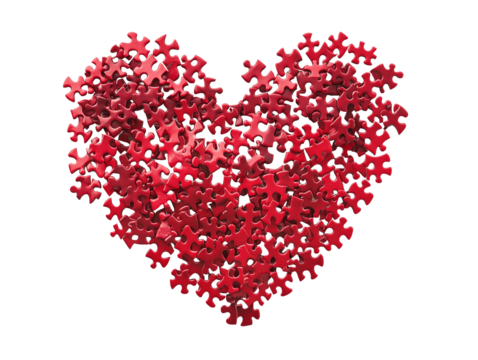 Red puzzle pieces arranged in a heart shape symbolize love and connection during a creative activity