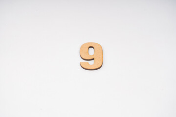 Number zero nine in leather on yellow background