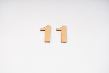 Obraz premium Number eleven in paper on a white background.