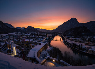 Winter sunset view from castle Kufstein over the Alps, river Inn and Christmas Market, Austria