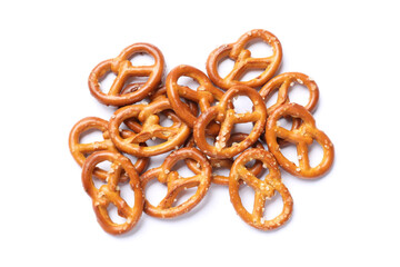 Many delicious pretzel crackers isolated on white, top view
