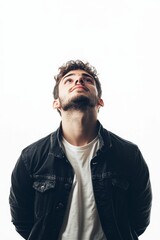 Obraz premium Young man, dark jacket, white shirt, looking up.