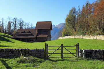 Old swiss tilery in autumn. View of the Alps. Municipality of Hofstetten bei Brienz, canton of Bern, Switzerland.