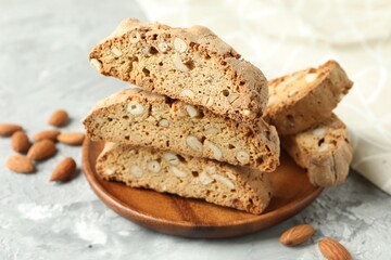 Fototapeta premium Traditional Italian almond biscuits (Cantucci) on grey textured table, closeup
