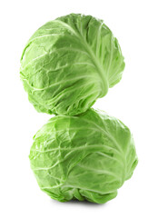 Two whole heads of cabbage isolated on white