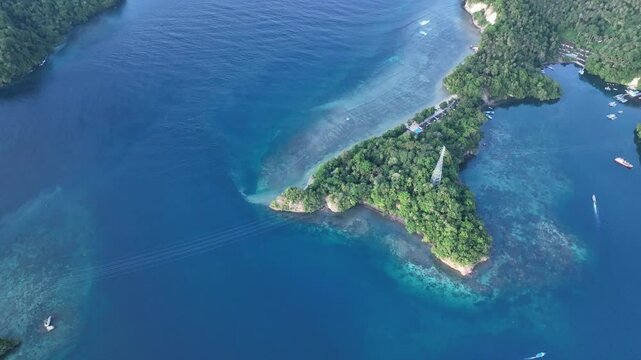 Calm water flows through Lembeh Strait in North Sulawesi. This tropical area is home to a plethora of marine biodiversity and is popular among divers.