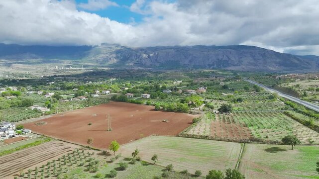 View of Olive groves and fields from a drone over Road E45, Castrovillari, Cosenza, Calabria, Italy, Europe