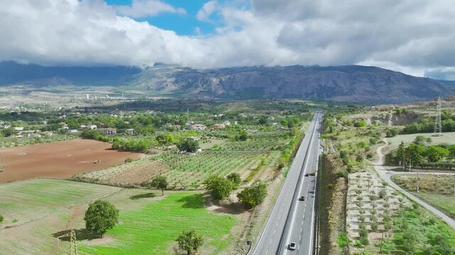 View of Olive groves and fields from a drone over Road E45, Castrovillari, Cosenza, Calabria, Italy, Europe