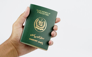 Brown Man Holding Pakistani Passport with White Background