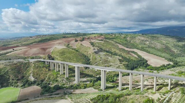View of Olive groves and fields from a drone over Road E45, Castrovillari, Cosenza, Calabria, Italy, Europe