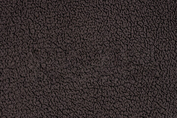 Fototapeta premium Close-up of a dark gray textured fabric.