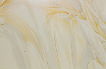 A cream-colored ceramic background with intricate patterns, blending softness and elegance. Perfect...