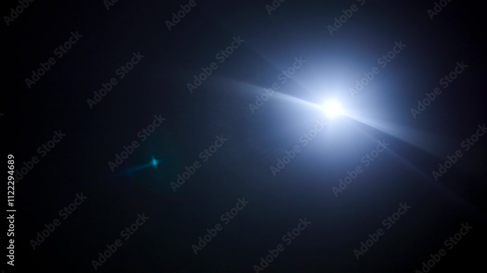 Poster Easy to add lens flare effects for overlay designs or screen blending mode to make high-quality images. Abstract sun burst, digital flare, iridescent glare over black background.