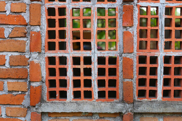 Detailed close-up of a brick ventilation system.