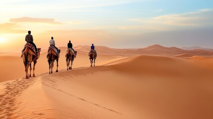 Four camel riders traverse orange desert dunes at sunset.