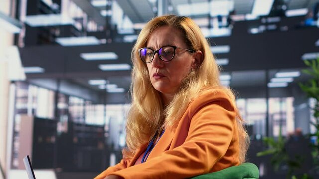Diverse businesswomen trying to discuss with disconnected detached CEO, suffering from depersonalization and apathy because of burnout. Gender equality women in business concept. Camera A.