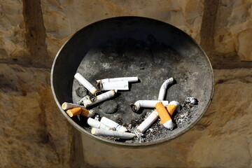 cigarette butts in an ashtray