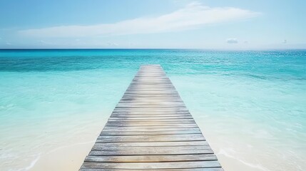 Travel image showing a wooden pier extending into the clear blue sea