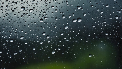 Fototapeta premium Abstract Rain Droplets on Glass Window with Rain and Dew Texture