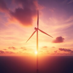 Obraz premium Silhouette of a wind turbine against a vibrant sunset over the ocean.