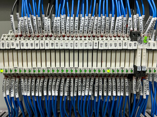 Electrical terminals for connecting the mounting wires in the control panel close-up.