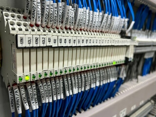 Electrical terminals for connecting the mounting wires in the control panel close-up.