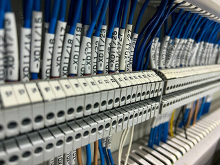 Electrical terminals for connecting the mounting wires in the control panel close-up.